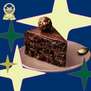 Chocolate cake on a plate with stars and the Stardust Astronaut Monkey in the background